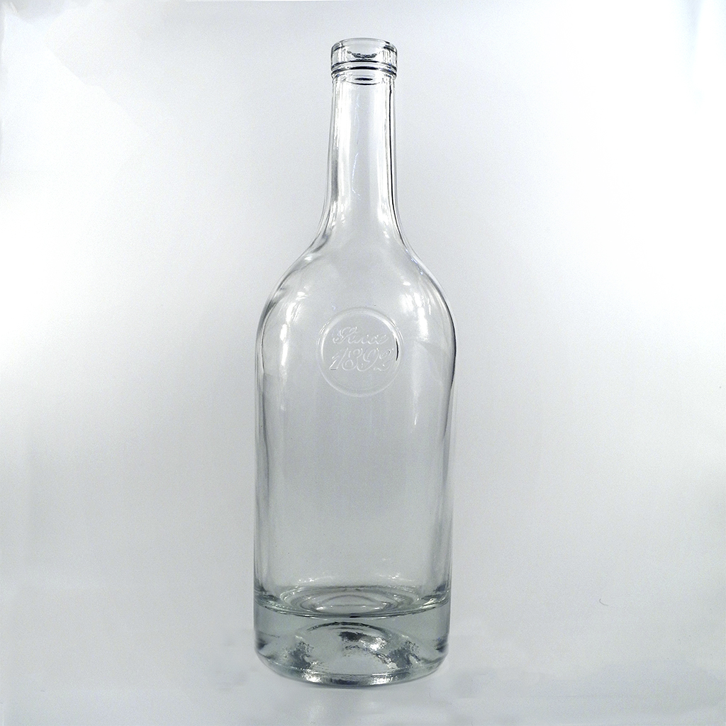 Transparent whiskey glass bottle